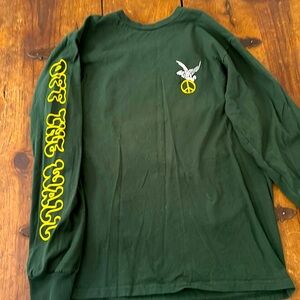 Gently used long sleeve tee shirt with graphics on arm and back